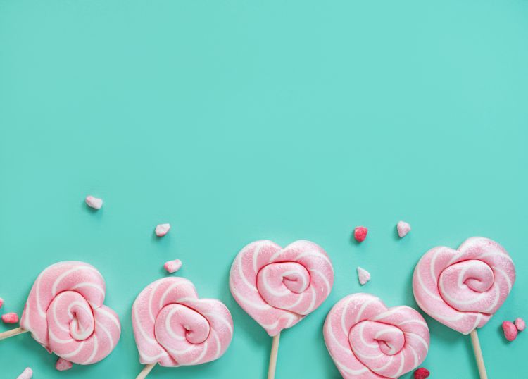 Pink lollipops in the shape of hearts